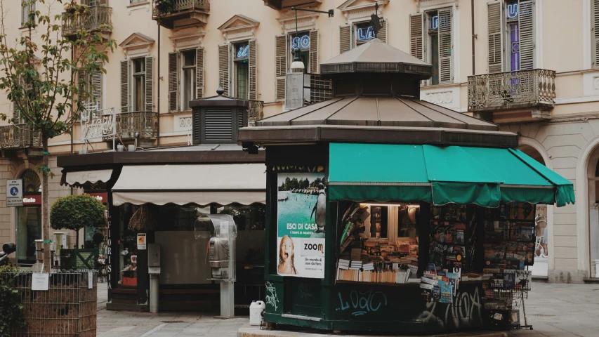 there is a small store with a green awning outside