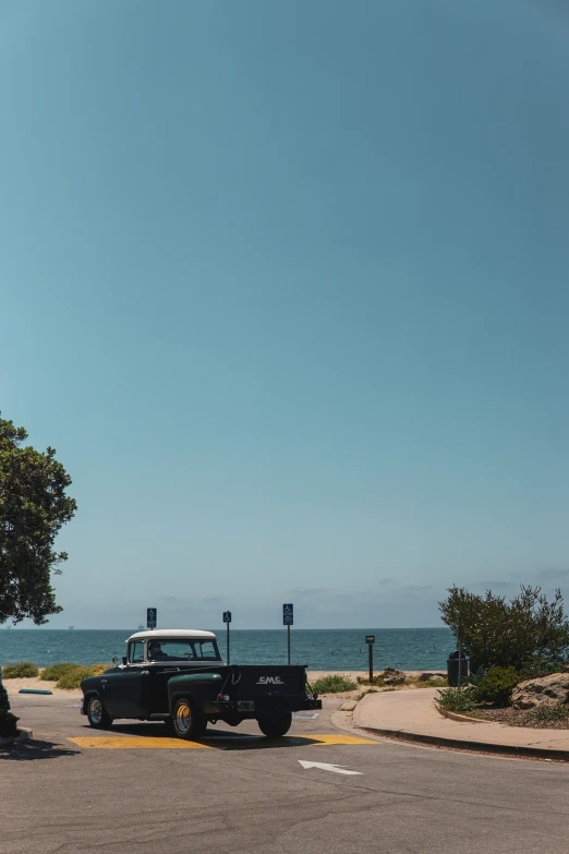 a black truck parked on the side of a street