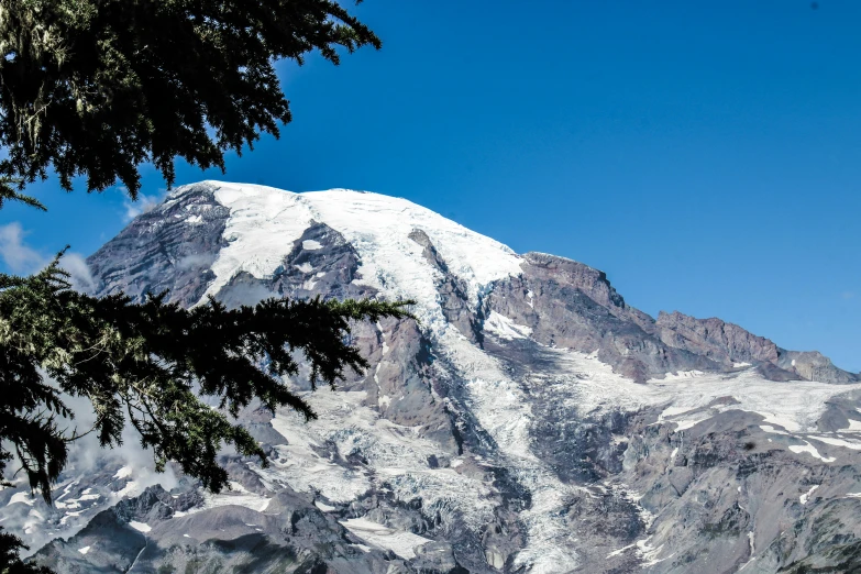 a white mountain peak is in the distance