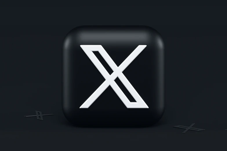 a black and white square icon with a white x on it