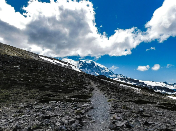 a dirt road on the side of a mountain