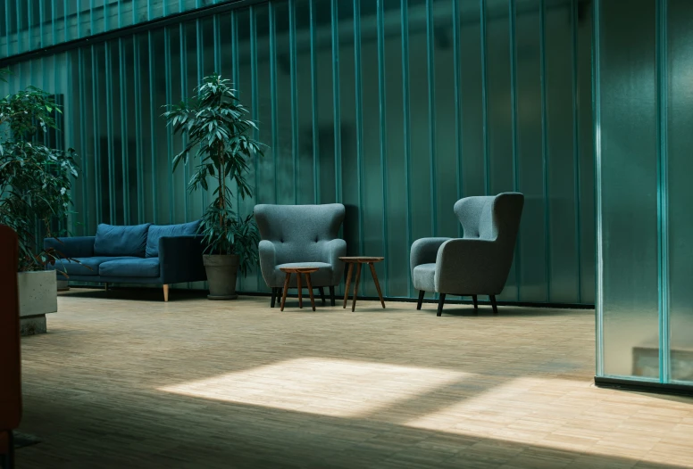 three chairs and a table in a room