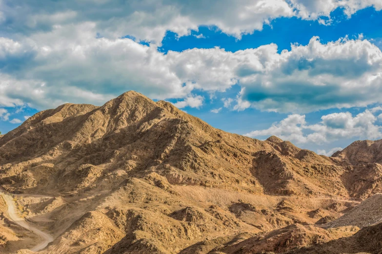 large mountain with many ridges in the desert