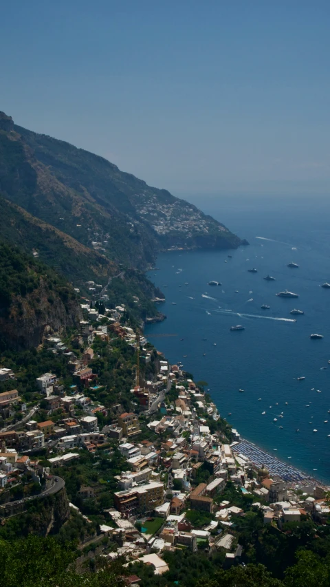 boats are in the water near many hills