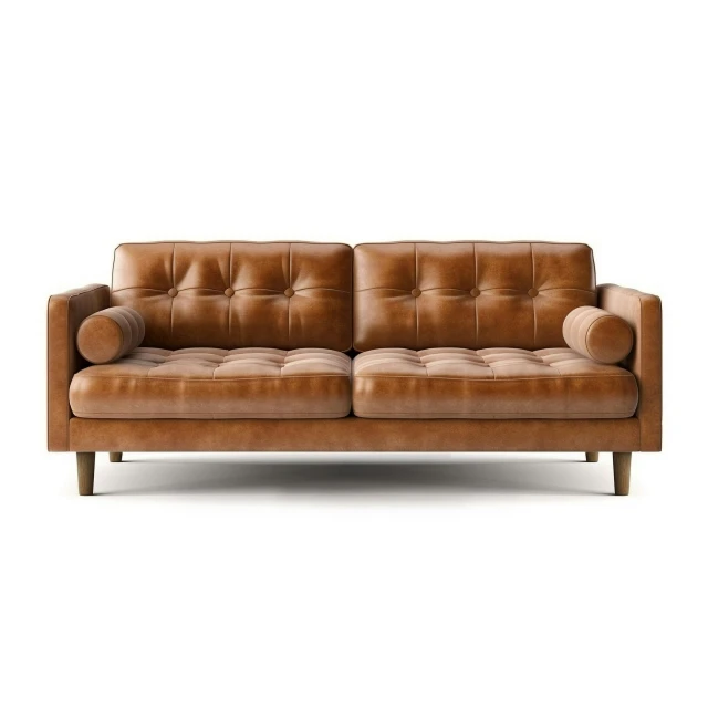 a tan couch with ons on the back and arm