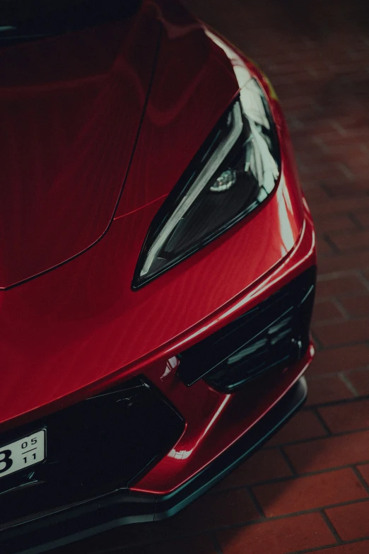 the front bumper end of a red sports car