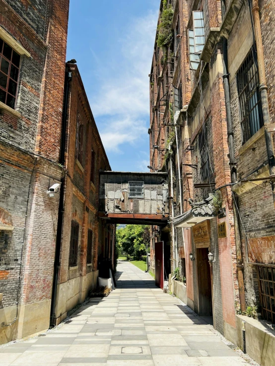 an alley way is blocked off with a brick wall