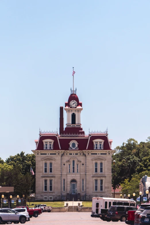 an old building with a clock tower sitting in front of it