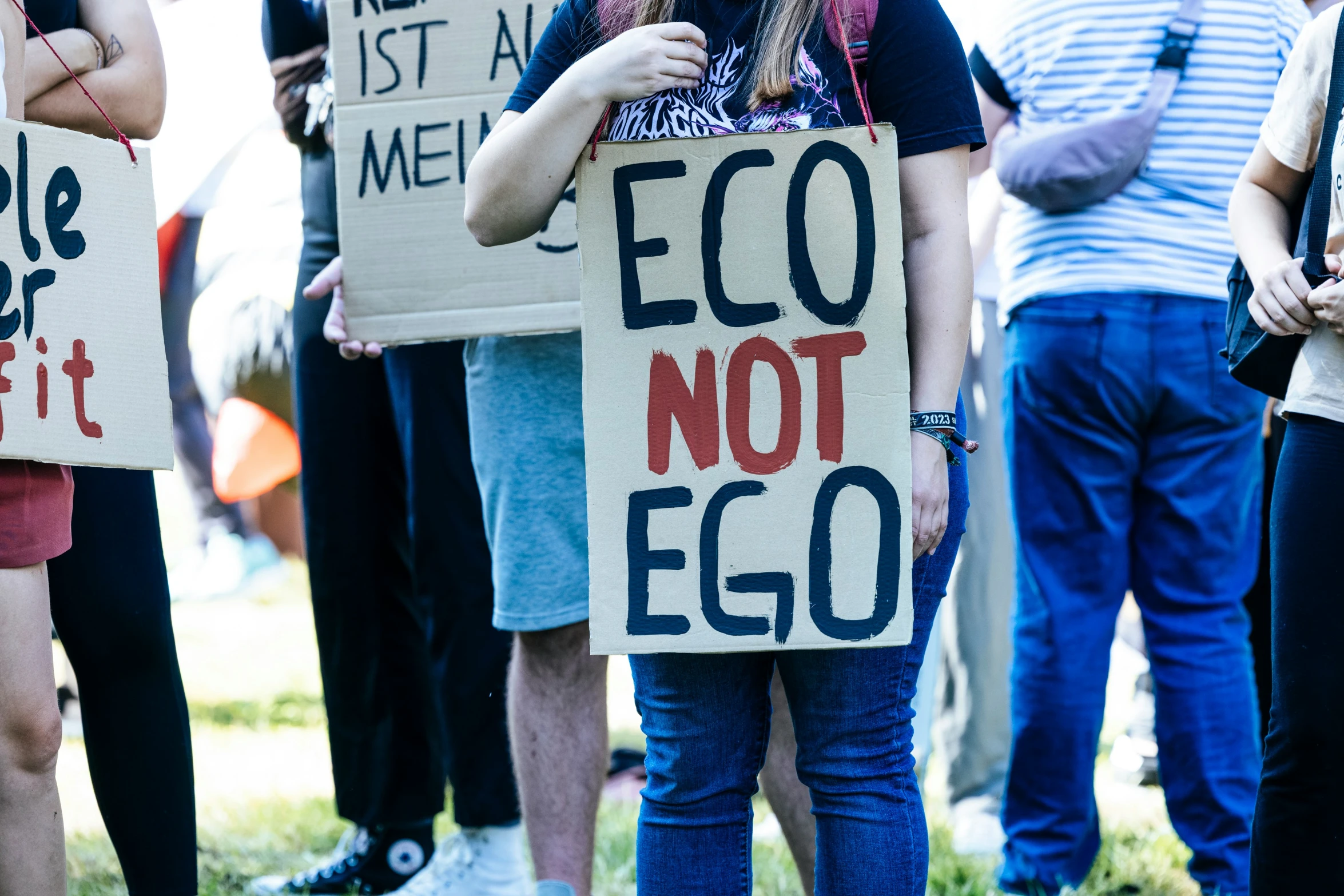 people are holding signs with different words