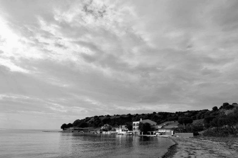 a beach that has many houses by the shore