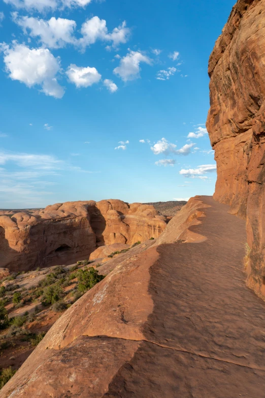 a large rock wall that has some dirt on it