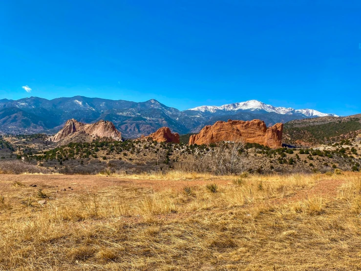 a mountain range sitting in the middle of a desert