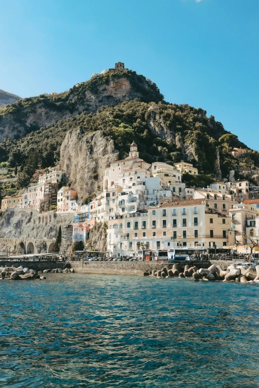 a view of some very old and colorful buildings by the water