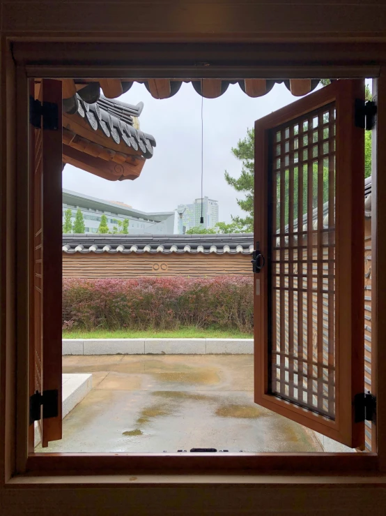 an open doorway into a walled courtyard