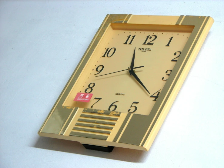 a clock has been designed to look like a golden block