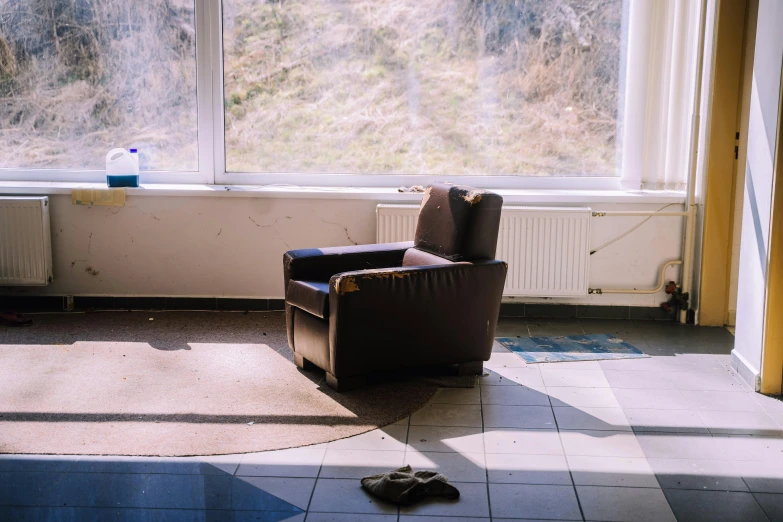 a broken chair in a room with no one inside