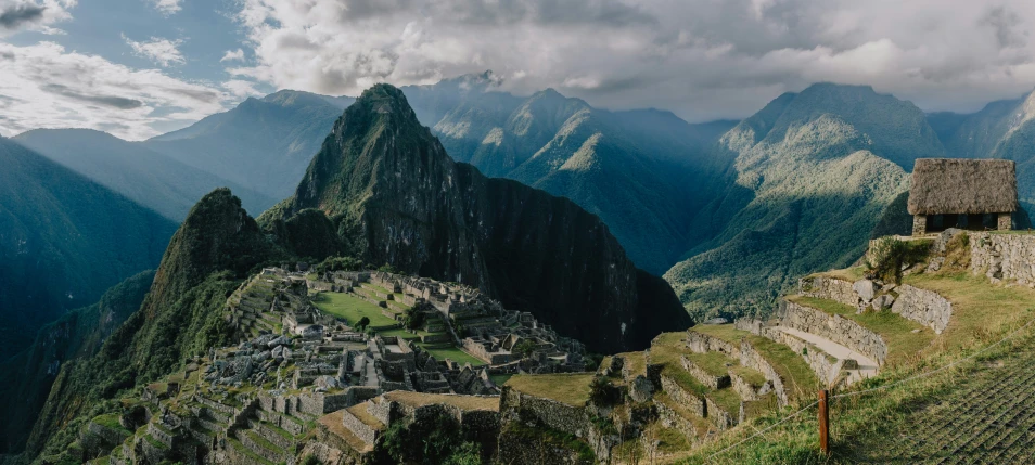 the mountains around machaca ruins are quite dramatic