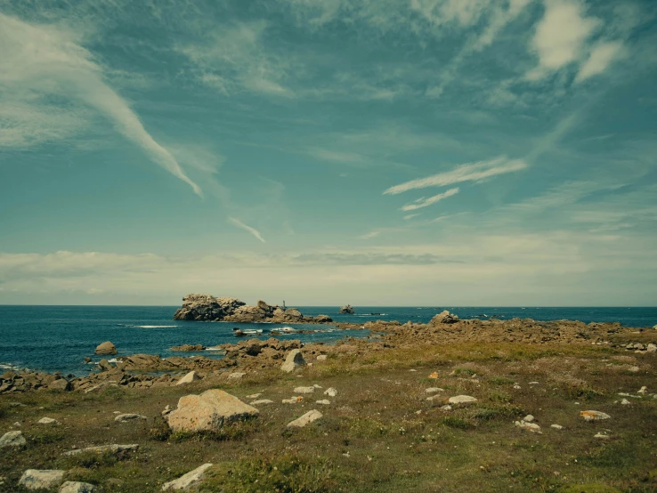 an island with small rocks in the ocean