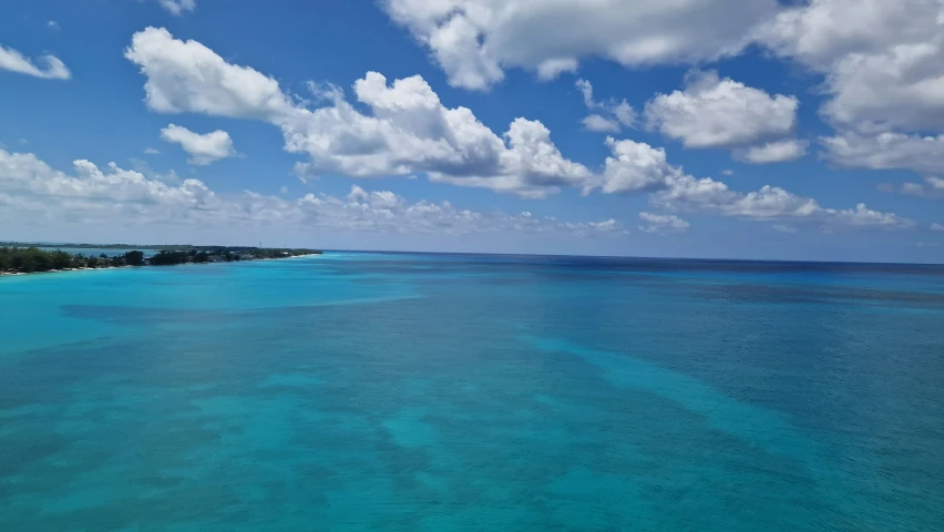 view of the waters and coast from a ship in the ocean