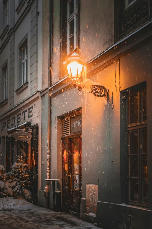 the street light shines on a rainy day in paris