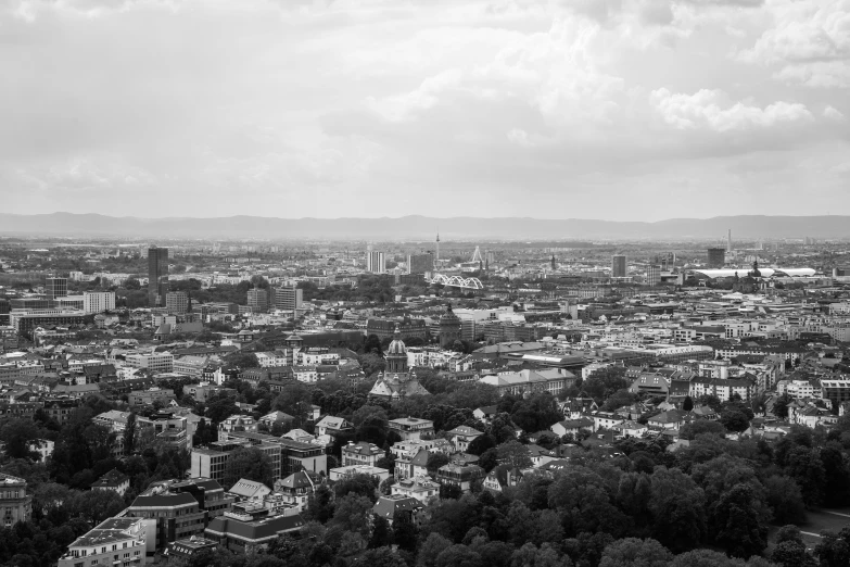 black and white pograph of buildings on land in the city