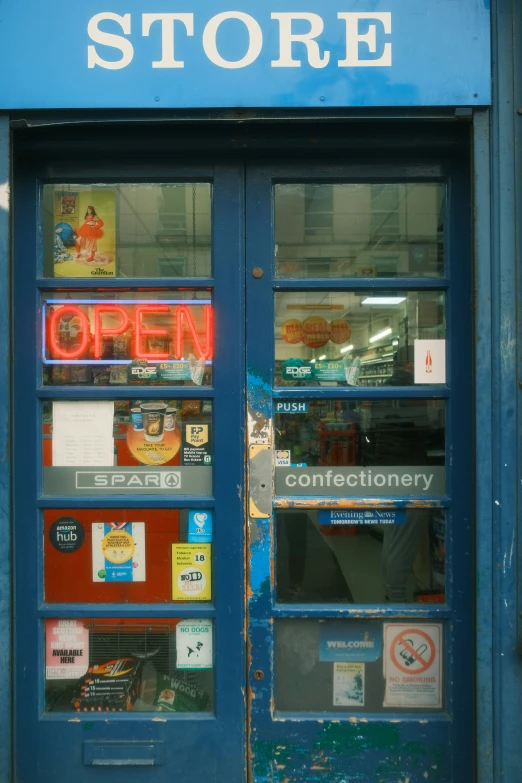 a store that is open and has signs on it