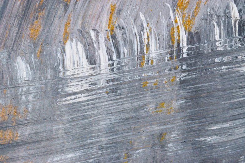 an abstract painting with some gray yellow paint