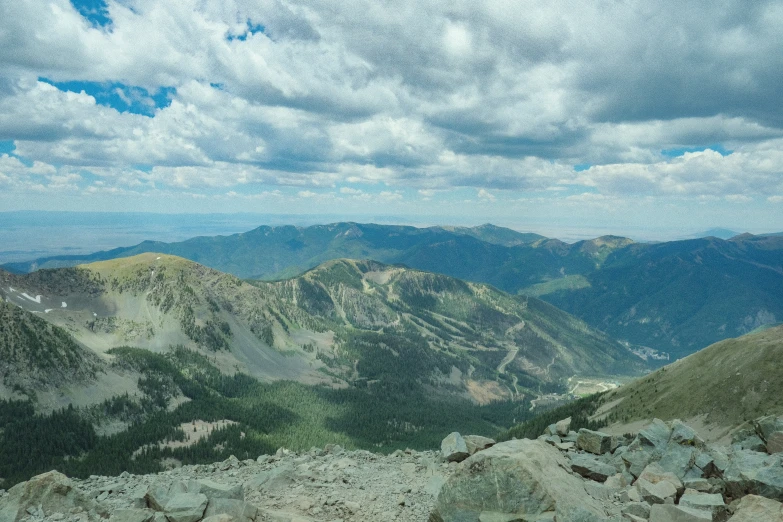 an expansive rocky mountain landscape in the mountains