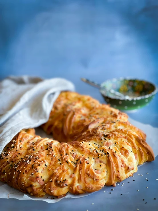 some kind of bread is wrapped in a napkin