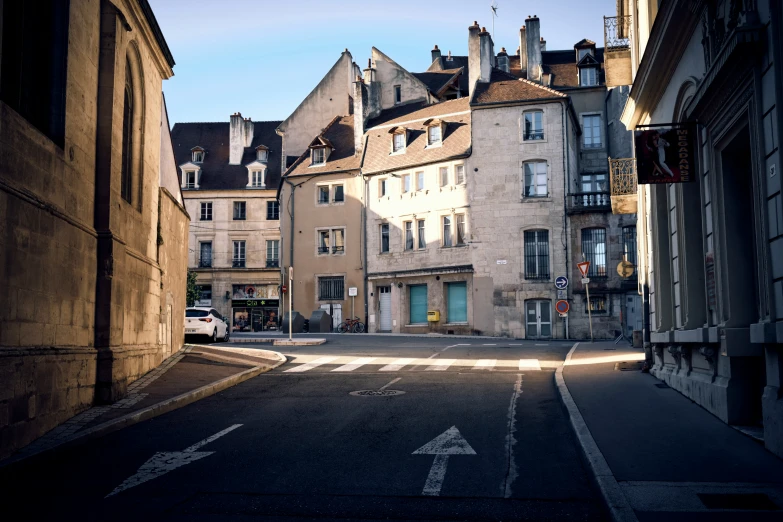 the corner of a city street has two buildings