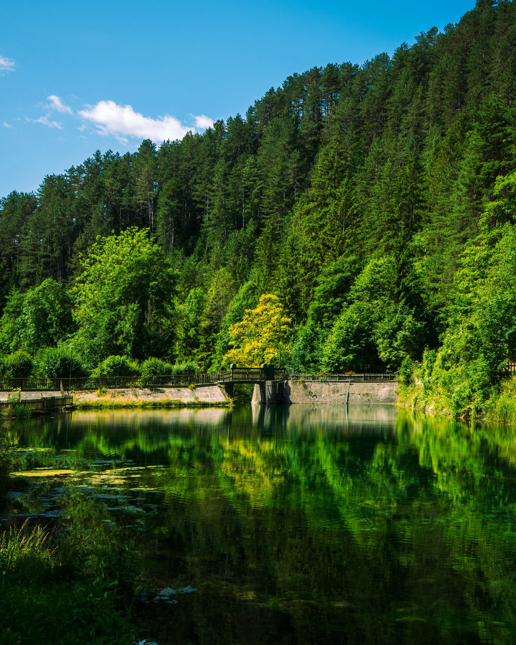 the water in this lake is reflective in the sunlight