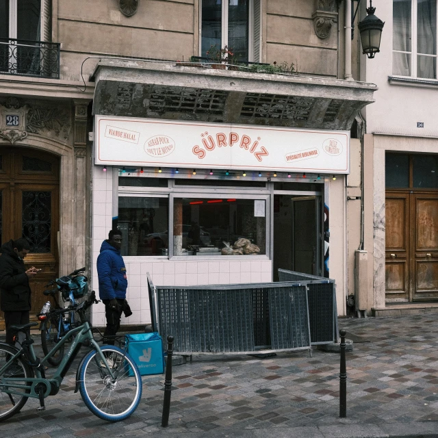 a person is standing in front of the store