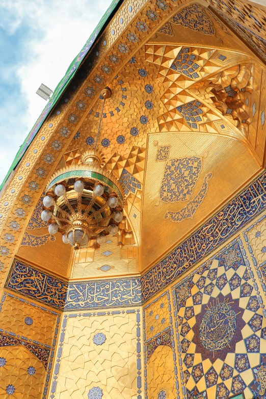 an ornately detailed ceiling in the middle of a building