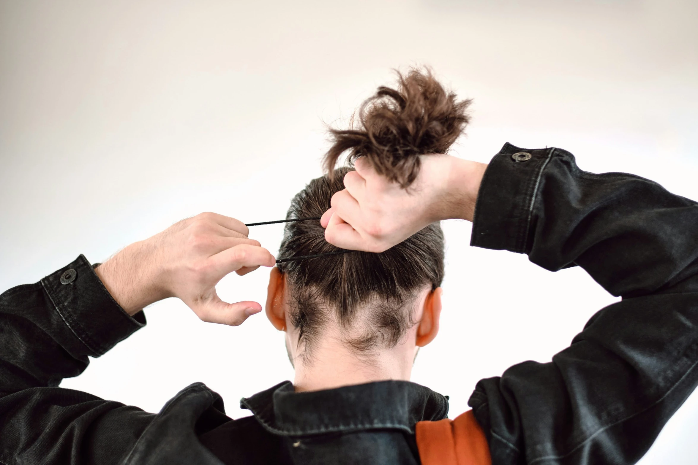 a person has their hair pinned up with hair clips