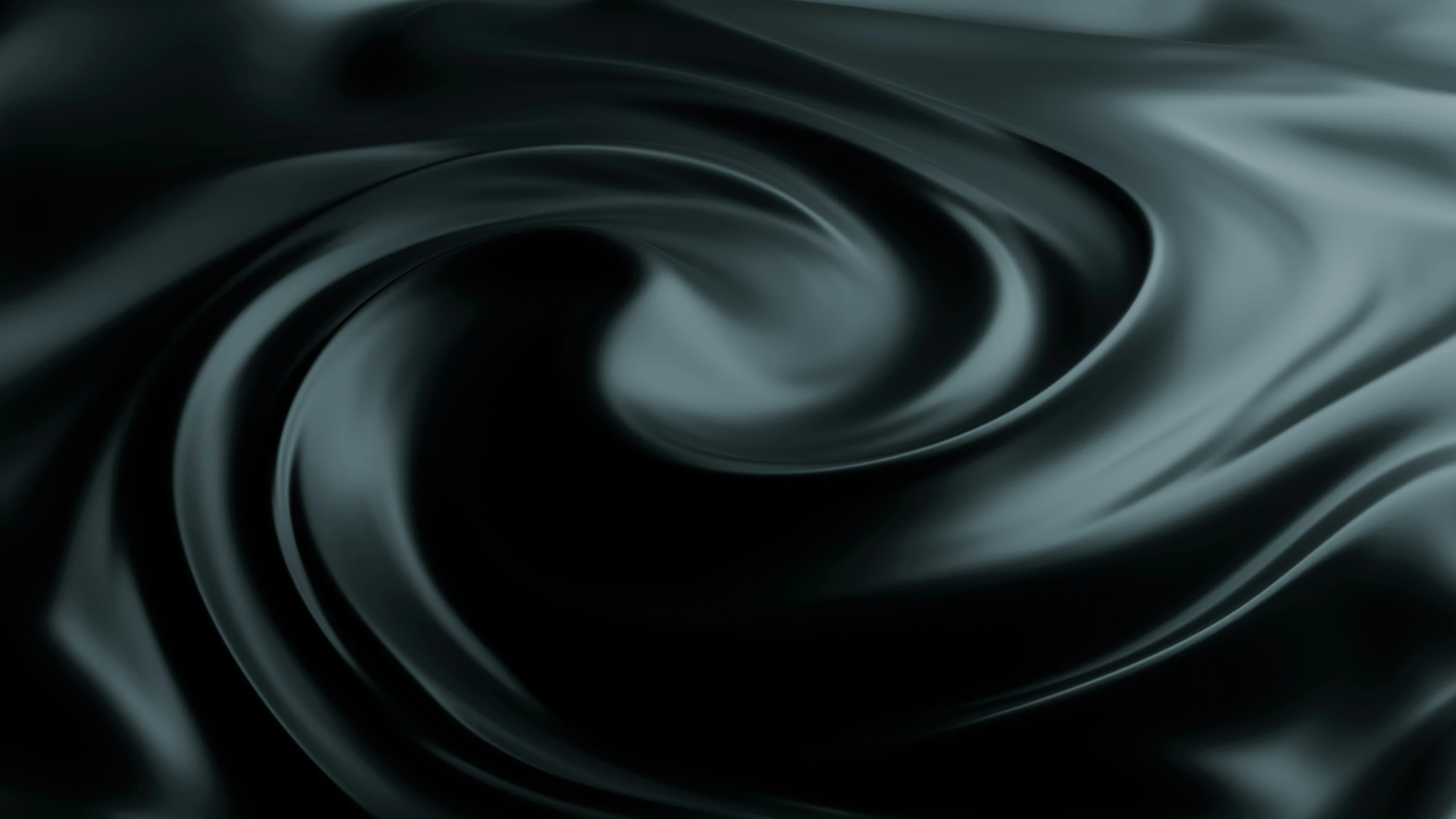 an abstract black, grey swirl