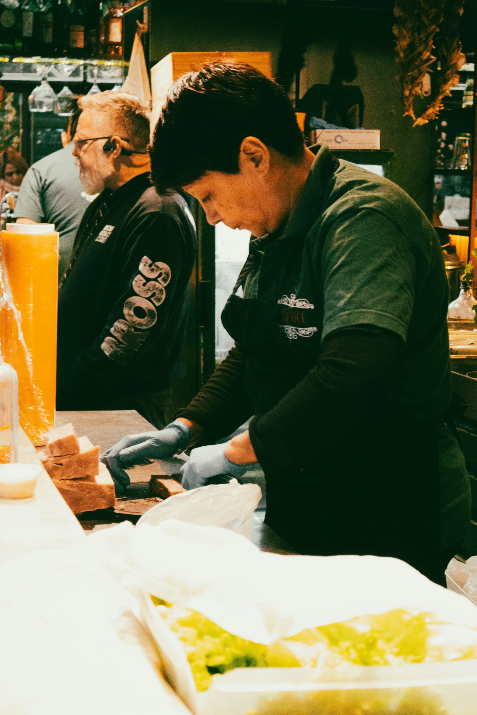 a person sits at a table with food