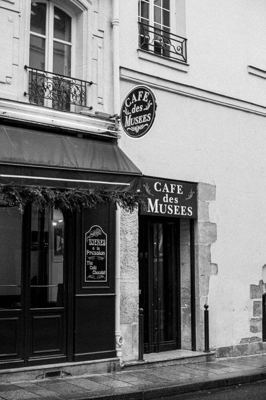 two story building on the street corner with signs