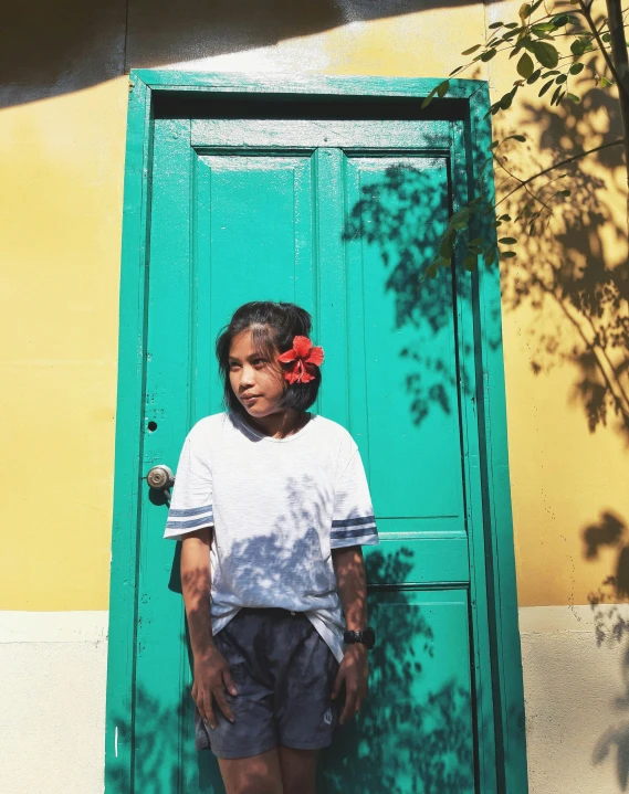 a child poses for a po while outside the doors