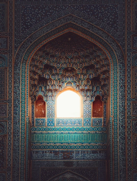 an artistic architectural wall and door with sunlight beaming into the window