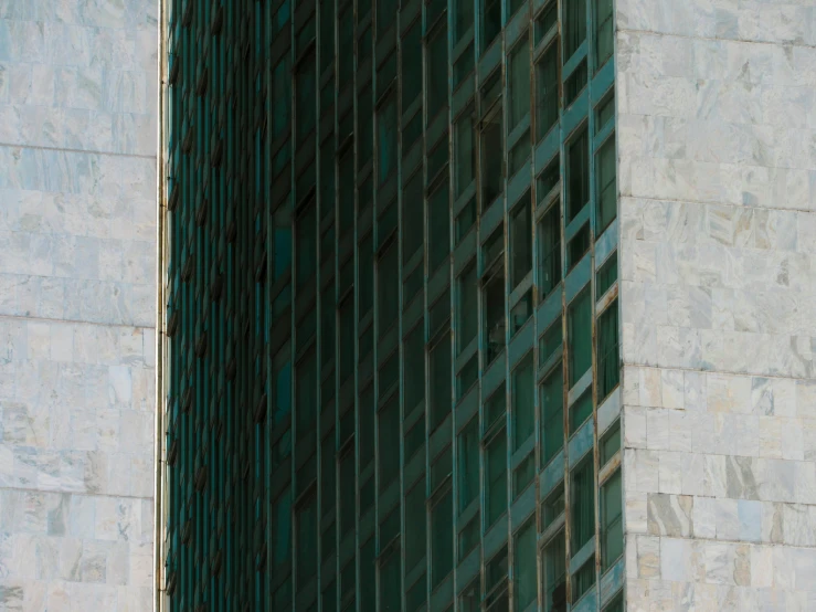 a building with a clock is seen from below