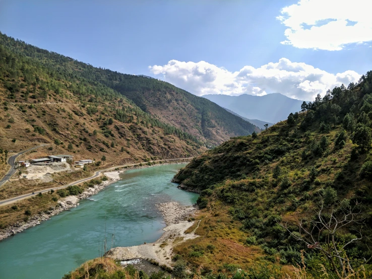 the view of a river and some mountains from above