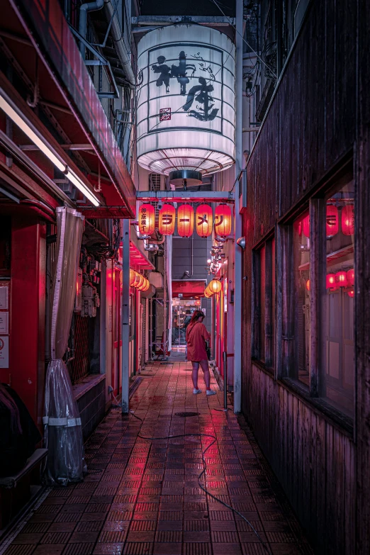 a long narrow hallway with neon lights all over