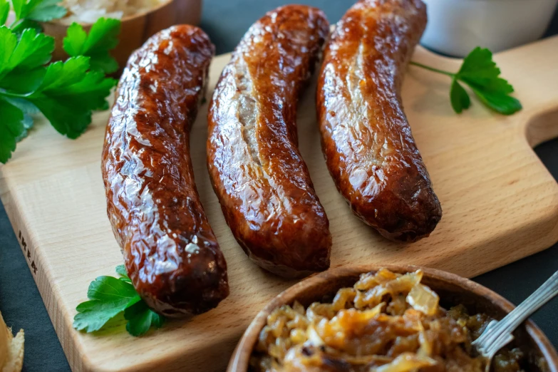 an assortment of meaty items on a  board