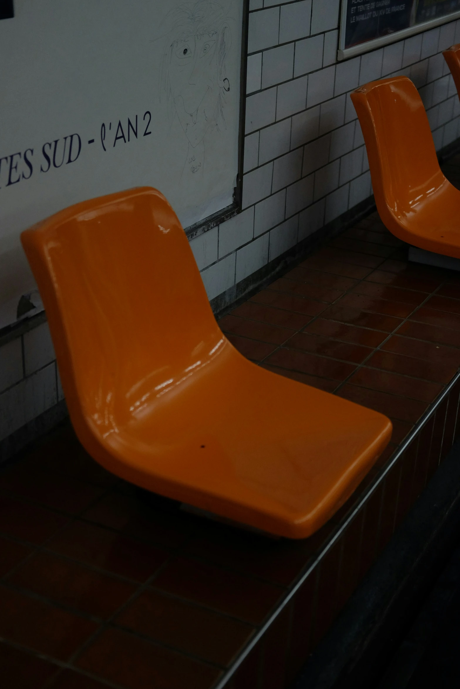 some chairs that are in front of a wall