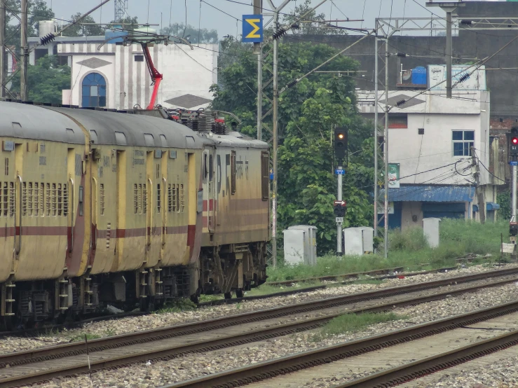 a passenger train sitting at the end of two rows of tracks