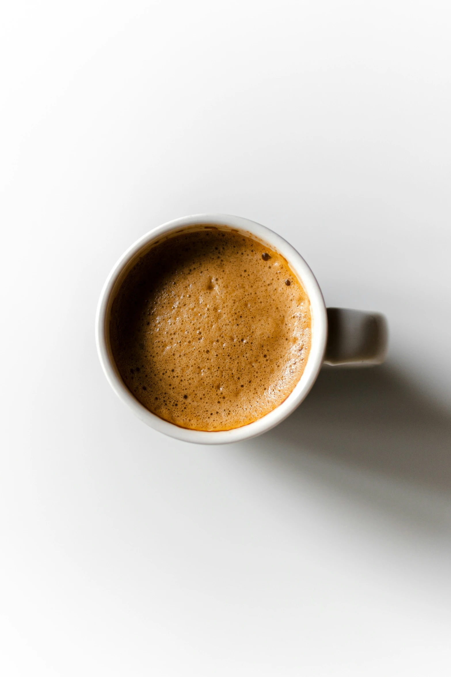 a coffee cup with a light shadow on it