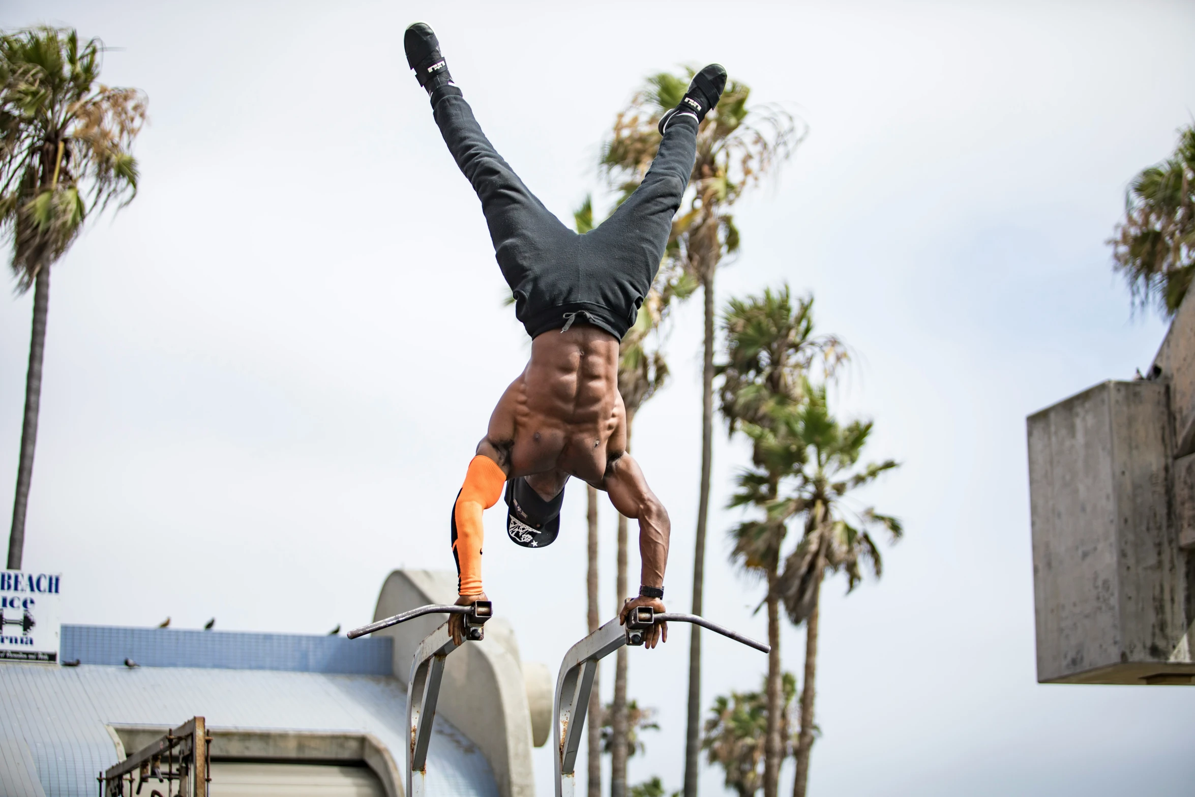 the young man is performing a stunt on the bicycle