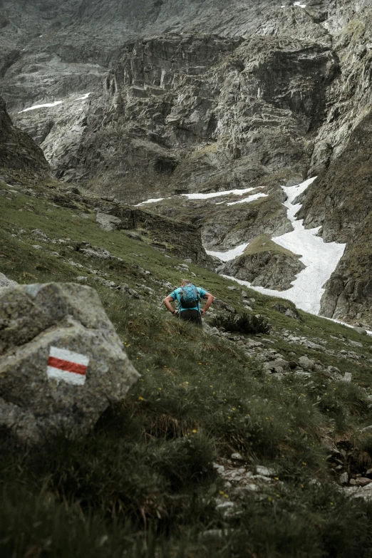 a person with a backpack is in the mountains