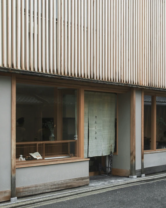 this building has a large wooden window and many small windows