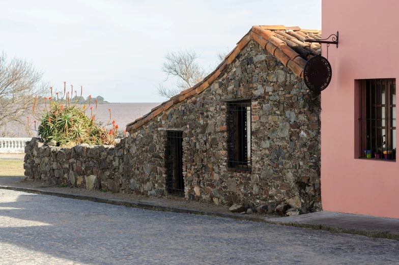 a pink house made out of rocks and bricks